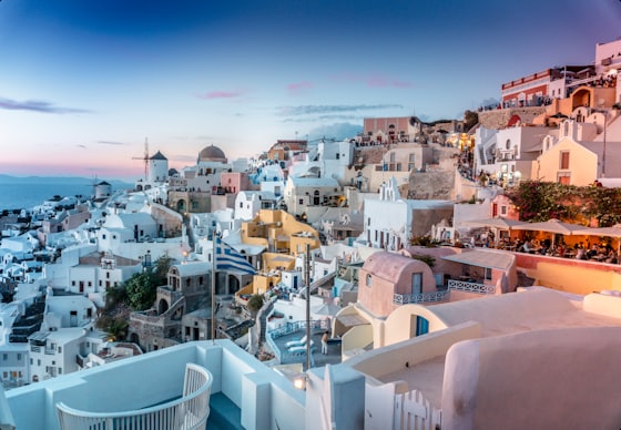 White hillside buildings overlooking the sea in Santorini, Greece